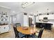 Open-concept dining area with a view of the kitchen and stainless steel appliances at 9063 Moyer Pl, Pendleton, IN 46064