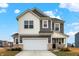 Charming two-story home featuring a two-car garage and nicely landscaped front yard at 9063 Moyer Pl, Pendleton, IN 46064