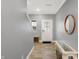 Inviting foyer featuring a stylish console table, a mirror, and modern flooring at 9063 Moyer Pl, Pendleton, IN 46064