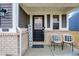 Inviting front porch with seating and decor adds charm to the home's exterior at 9063 Moyer Pl, Pendleton, IN 46064