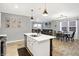 Open kitchen with stainless steel appliances, a large island, and a view to the living space at 9063 Moyer Pl, Pendleton, IN 46064