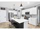 Bright kitchen featuring stainless steel appliances, center island with seating, and modern pendant lighting at 9063 Moyer Pl, Pendleton, IN 46064