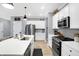 Well-lit kitchen featuring stainless steel appliances, a functional island with seating, and ample cabinet space at 9063 Moyer Pl, Pendleton, IN 46064