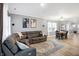 Bright living room with a large sectional sofa, decorative rug, and open layout perfect for entertaining at 9063 Moyer Pl, Pendleton, IN 46064