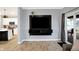 Comfortable living room showcasing an entertainment center and open flow to the adjacent kitchen at 9063 Moyer Pl, Pendleton, IN 46064