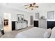 Main bedroom with white paneled walls and ceiling fan has a closet and two dressers at 9063 Moyer Pl, Pendleton, IN 46064