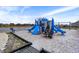 Community playground offers blue slides, climbing structures, and swings for outdoor fun at 9063 Moyer Pl, Pendleton, IN 46064