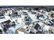 Aerial view of a snow-covered residential neighborhood showcasing well-maintained homes and tree-lined streets at 9239 Stones Ferry Way, Indianapolis, IN 46278