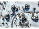 Birds eye view of snow-covered homes with intricate roof lines, surrounded by trees and quiet, snow-covered streets at 9239 Stones Ferry Way, Indianapolis, IN 46278