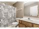 Bathroom featuring a combination shower and tub with a black and white patterned shower curtain at 9239 Stones Ferry Way, Indianapolis, IN 46278