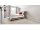 Cozy bedroom with a sloped ceiling, neutral walls, and plush carpeting at 9239 Stones Ferry Way, Indianapolis, IN 46278