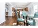 Open dining area with hardwood floors offering seamless flow into the adjacent kitchen at 9239 Stones Ferry Way, Indianapolis, IN 46278