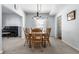 Comfortable dining room with neutral carpet, light-colored walls, and wooden table at 9239 Stones Ferry Way, Indianapolis, IN 46278