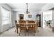 Inviting dining room with large table perfect for gatherings and a charming chandelier at 9239 Stones Ferry Way, Indianapolis, IN 46278