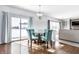 Cozy dining area with seating for four and sliding glass doors to the backyard at 9239 Stones Ferry Way, Indianapolis, IN 46278