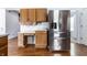 Bright kitchen with stainless steel refrigerator and extra cabinet space at 9239 Stones Ferry Way, Indianapolis, IN 46278