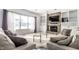 Cozy living room featuring a brick fireplace, built-in shelving, and comfortable seating at 9239 Stones Ferry Way, Indianapolis, IN 46278