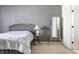 Bright main bedroom featuring neutral colors, soft carpet, and ensuite bathroom at 9239 Stones Ferry Way, Indianapolis, IN 46278