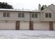 Multi-Gathering garage exterior with snow on the ground at 9523 Maple Way, Indianapolis, IN 46268