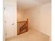 Hallway with carpet and wooden banister at 9523 Maple Way, Indianapolis, IN 46268