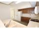 Kitchen featuring white appliances and wooden cabinets at 9523 Maple Way, Indianapolis, IN 46268