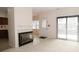 Bright living room with a tiled fireplace and sliding glass doors offering great light at 9523 Maple Way, Indianapolis, IN 46268