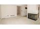 Inviting living space featuring neutral walls and carpet, adjacent to a kitchen with white appliances at 9523 Maple Way, Indianapolis, IN 46268