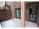 Cozy covered porch with brick detail, offering a welcoming entry to the home at 9523 Maple Way, Indianapolis, IN 46268
