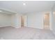 View of the spacious basement featuring neutral walls, carpet flooring, and an open doorway at 9634 Beckett St, Avon, IN 46123