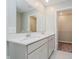 Bathroom vanity featuring double sinks, quartz countertops and a view into the closet at 9634 Beckett St, Avon, IN 46123