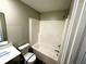Bathroom with a shower-tub combo, toilet, and vanity at 9634 Beckett St, Avon, IN 46123