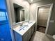 Bathroom featuring a double vanity, tiled floors, and access to a walk-in closet at 9634 Beckett St, Avon, IN 46123