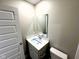 Bathroom with a white vanity, mirror, and toilet at 9634 Beckett St, Avon, IN 46123
