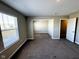 Large carpeted bedroom with neutral walls, bright windows and adjoined space at 9634 Beckett St, Avon, IN 46123