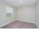 An inviting bedroom with plush carpet, neutral walls, and a bright window view at 9634 Beckett St, Avon, IN 46123