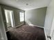 This bedroom features neutral paint, a large window, and plush carpeting at 9634 Beckett St, Avon, IN 46123