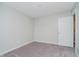 A bedroom showcases neutral walls, plush carpet, and a doorway at 9634 Beckett St, Avon, IN 46123