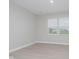 Bright bedroom with stylish plank floors and large windows offering neighborhood views at 9634 Beckett St, Avon, IN 46123