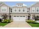 Charming townhome featuring an attached two car garage, manicured landscaping and inviting curb appeal at 9634 Beckett St, Avon, IN 46123