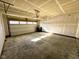 Spacious two-car garage with an automatic door, ready for customization and ample storage solutions at 9634 Beckett St, Avon, IN 46123