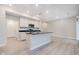 Modern kitchen with kitchen island, black countertops, stainless appliances, and recessed lighting at 9634 Beckett St, Avon, IN 46123