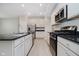 Modern kitchen featuring stainless steel appliances, black countertops and ample cabinet space at 9634 Beckett St, Avon, IN 46123