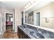 Bathroom with dual sinks, large mirror, and tiled floor at 1058 W Limestone Way, Fortville, IN 46040