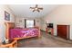 Bedroom featuring a vaulted ceiling, large window, and wooden furniture at 1058 W Limestone Way, Fortville, IN 46040