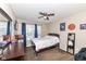Bedroom with a ceiling fan, large window, and a small desk at 1058 W Limestone Way, Fortville, IN 46040