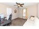 Comfortable bedroom with a ceiling fan, neutral colors, and bright window at 1058 W Limestone Way, Fortville, IN 46040