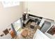 An airy kitchen with dark cabinets, stainless appliances, and a breakfast area bathed in natural light at 1058 W Limestone Way, Fortville, IN 46040