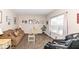 A cozy living room with a large window, neutral colors, and comfortable furnishings for relaxation at 1058 W Limestone Way, Fortville, IN 46040