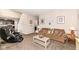 Enjoy the open layout of this living room, complete with a cozy sofa and easy access to the kitchen at 1058 W Limestone Way, Fortville, IN 46040