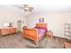 Main bedroom featuring a wooden bed frame, dresser, and vaulted ceilings at 1058 W Limestone Way, Fortville, IN 46040